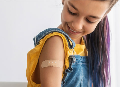 teen patient showing vaccinated arm after antiviral injection