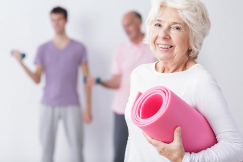 Older woman and yoga mat