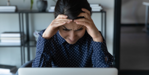 woman survivor stressed and at work