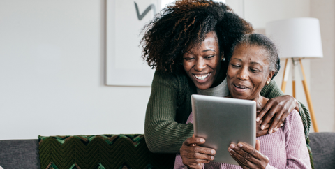 caregiver with survivor using ipad