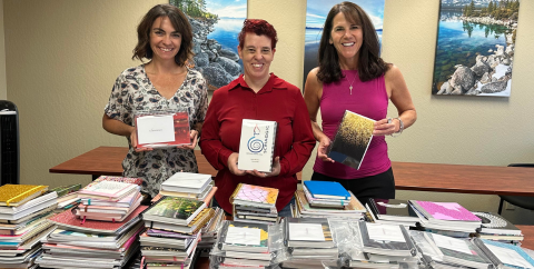 NCC and ThriveNV staff with Gina Billino of Scriaggio with a journal donation.