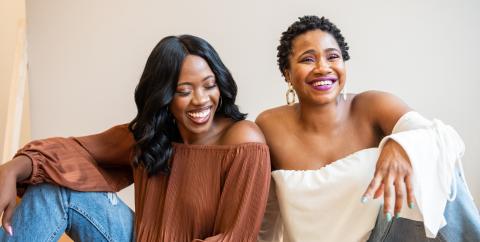 Two Black women laughing