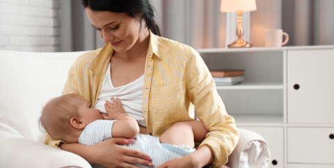 a woman breastfeeding an infant