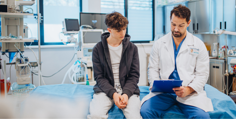 a childhood cancer survivor talks to a doctor