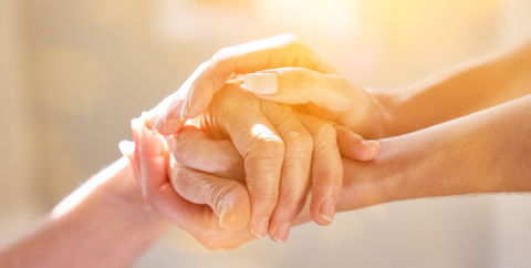 a person holding another person's hands